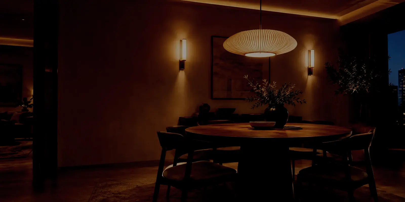 Dining room with layered decorative lighting at a low level
